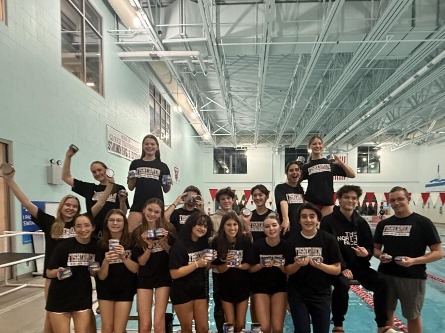 group donating tuna cans