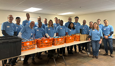 Corporate group visited to tour and build snack bags to give bag.