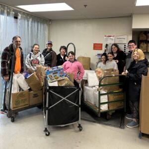 Group from Temple B'Nai Abraham dropping off donations from their High Holidays drive