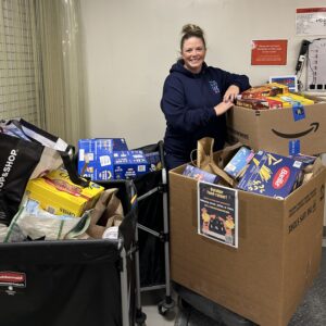 Howard-Nagus Family dropping off donations collected from their Haunted House food drive